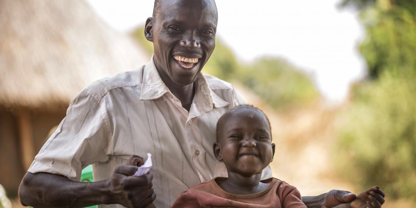 David Zakayo with his child. Through the Oxfam We care training, men like David now help out in house hold chores as well as taking care of their children. Most men in David's community in Lamwo district would leave all the responsibility of care work to women. Photo by Julius Kasujja/Oxfam David Zakayo with his child. Through the Oxfam We care training, men like David now help out in house hold chores as well as taking care of their children. Most men in David's community in Lamwo district would leave all the responsibility of care work to women